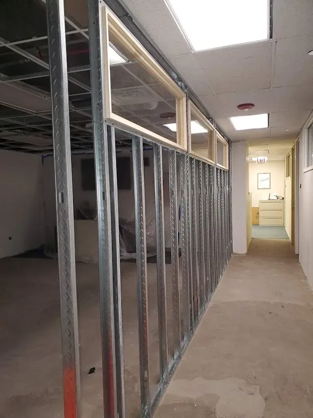 Metal stud partitions framed out along a corridor